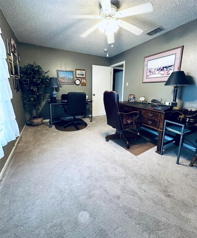1402 Marie St N, Comanche, TX 76442 - carpeted home office with a textured ceiling and ceiling fan
