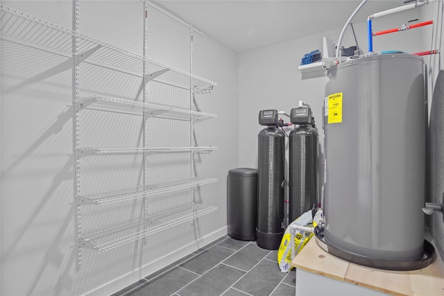 utility room featuring electric water heater