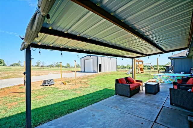 view of patio / terrace featuring a storage shed and an outdoor living space