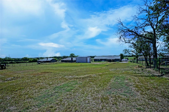 view of yard with a rural view