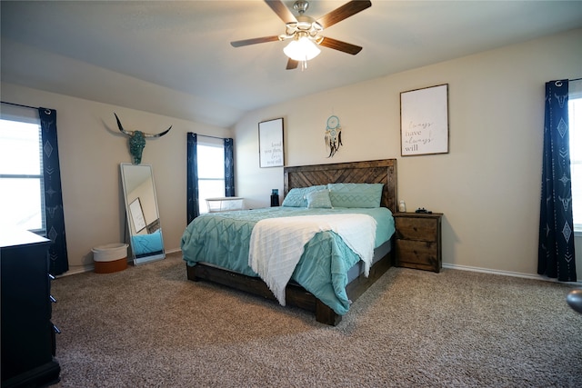 bedroom featuring carpet floors, vaulted ceiling, and ceiling fan