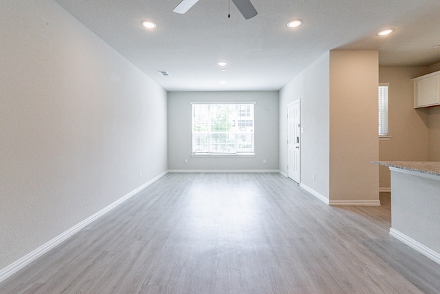 interior space featuring ceiling fan and light hardwood / wood-style floors