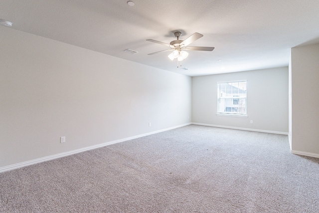 unfurnished room featuring carpet and ceiling fan