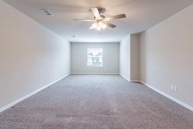 spare room featuring carpet flooring and ceiling fan