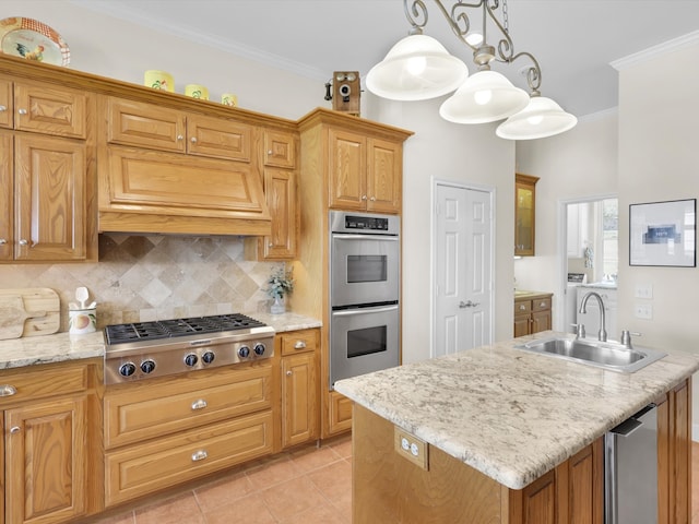 kitchen with an island with sink, ornamental molding, light tile patterned flooring, decorative light fixtures, and appliances with stainless steel finishes