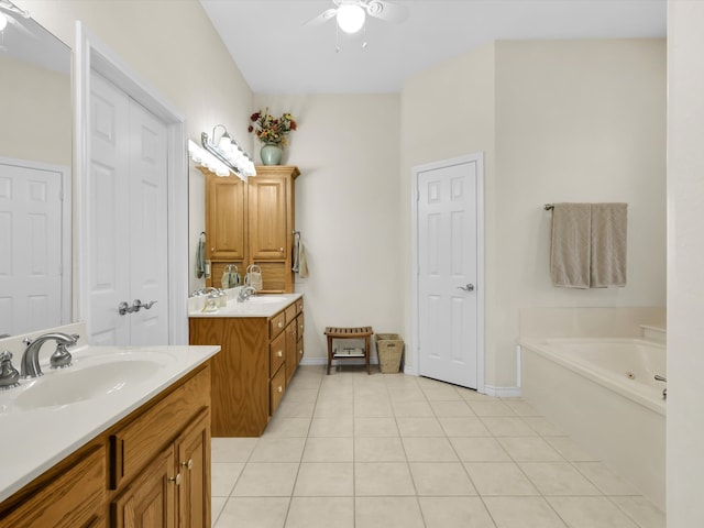 bathroom featuring vanity, a bathing tub, tile patterned floors, and ceiling fan