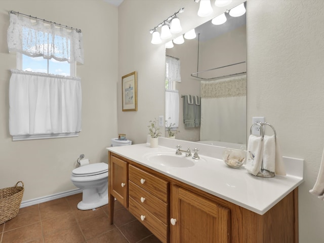 bathroom with vanity, toilet, walk in shower, and tile patterned flooring