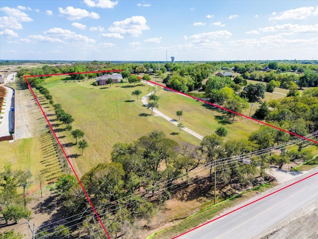 birds eye view of property with a rural view