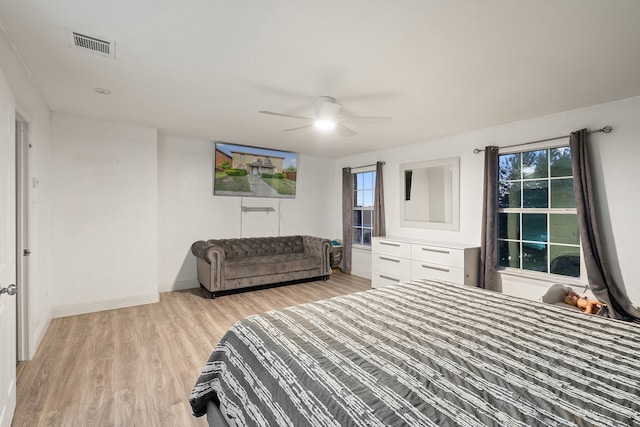 bedroom featuring light hardwood / wood-style flooring and ceiling fan