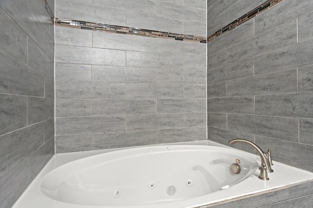 bathroom featuring tiled bath