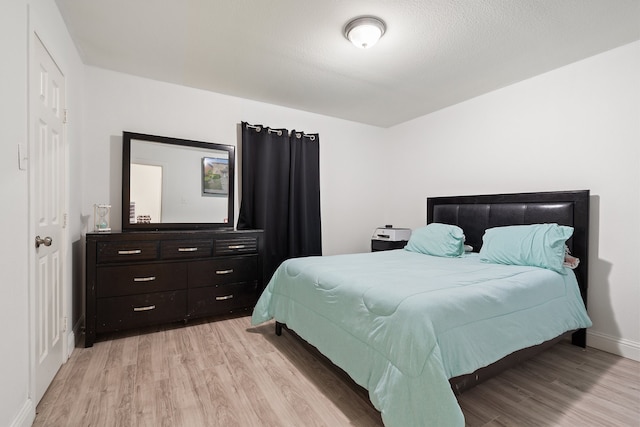 bedroom with light hardwood / wood-style flooring