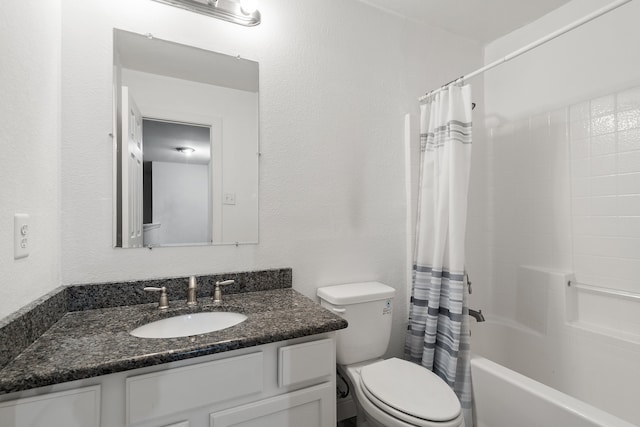 full bathroom with toilet, vanity, and shower / tub combo