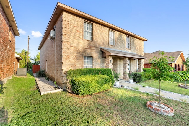 view of front of home featuring a front lawn and central AC unit