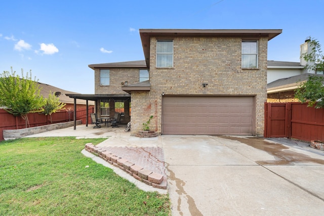 back of property with a yard, a patio area, and a garage