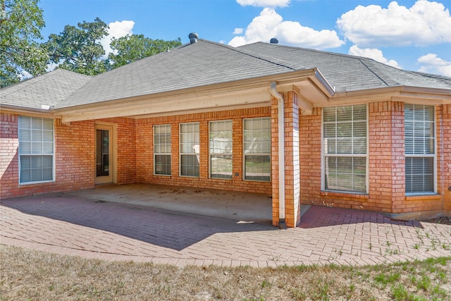 rear view of house featuring a patio area