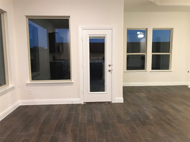 unfurnished room featuring dark wood-type flooring