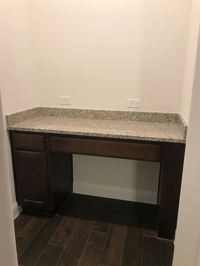 4111 Beamer Dr, Forney, TX 75126 - details featuring built in study area, baseboards, and wood tiled floor