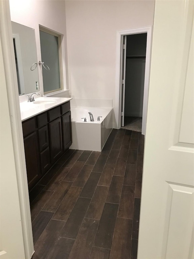 4111 Beamer Dr, Forney, TX 75126 - full bath featuring a bath, vanity, and wood tiled floor