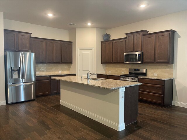 4111 Beamer Dr, Forney, TX 75126 - kitchen featuring visible vents, a sink, dark wood-style flooring, appliances with stainless steel finishes, and dark brown cabinets