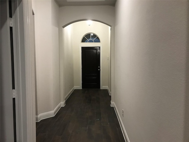 4111 Beamer Dr, Forney, TX 75126 - entryway featuring arched walkways, dark wood-type flooring, and baseboards