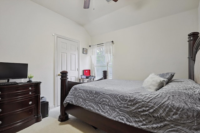 bedroom featuring carpet floors, vaulted ceiling, and ceiling fan