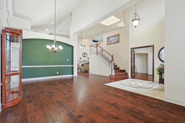 entryway featuring hardwood / wood-style flooring, a chandelier, and high vaulted ceiling