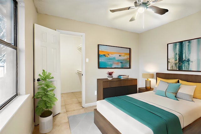 bedroom with light tile patterned flooring and ceiling fan