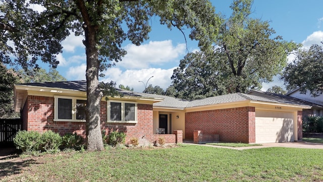 ranch-style house with a garage and a front lawn