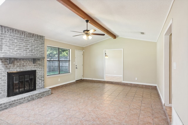 unfurnished living room featuring lofted ceiling with beams, a textured ceiling, a fireplace, light tile patterned floors, and ceiling fan