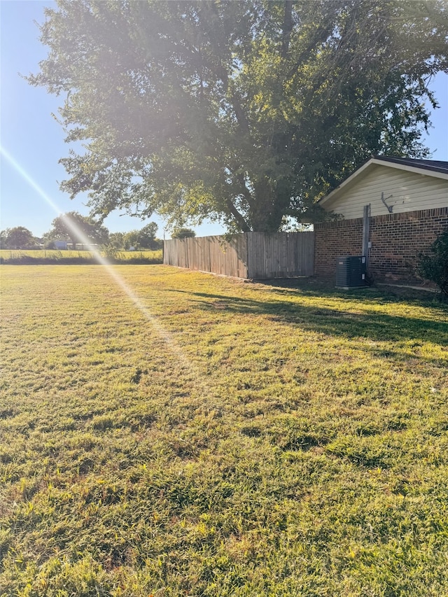 view of yard featuring central AC