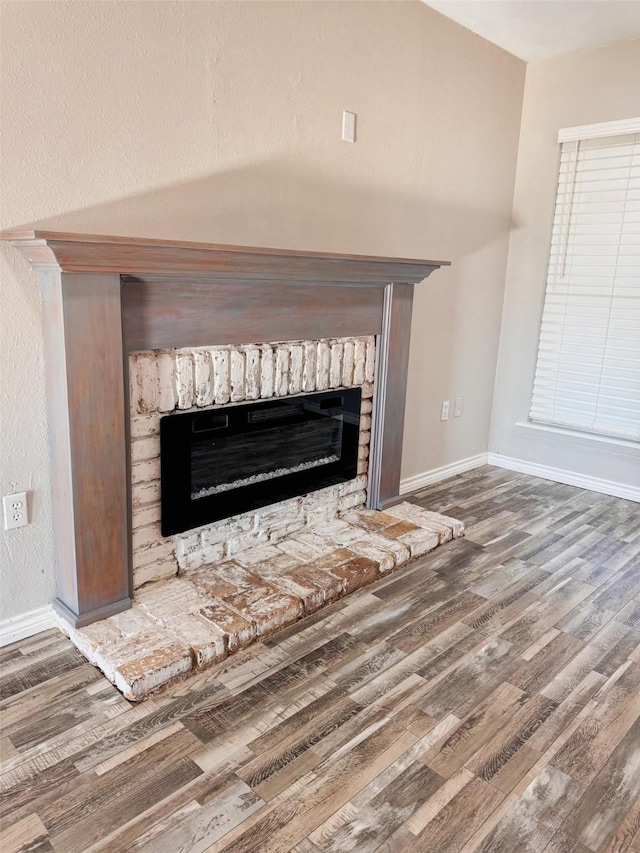 1417 Cottondale Rd, Springtown, TX 76082 - detailed view of a fireplace, wood finished floors, and baseboards