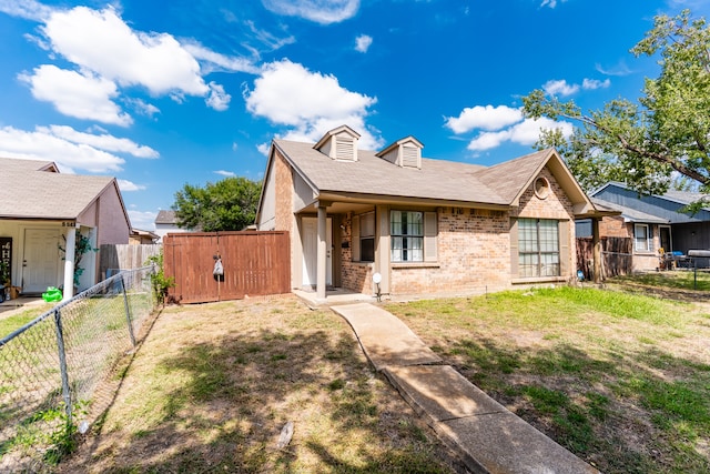 view of front of home with a front lawn