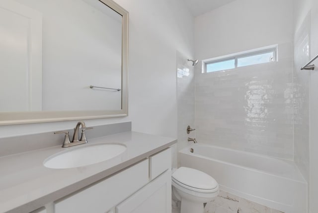 full bath with marble finish floor, shower / tub combination, vanity, and toilet