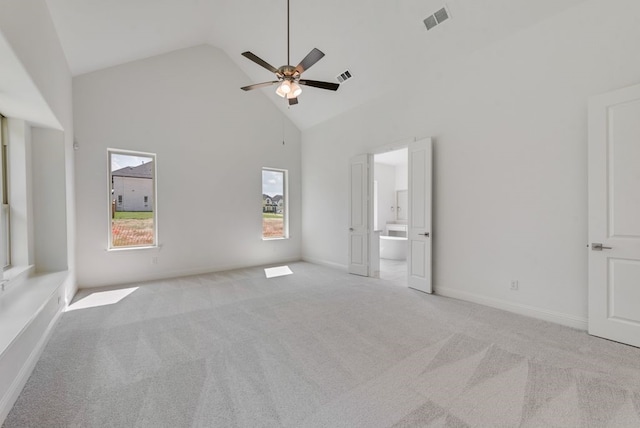 unfurnished room featuring high vaulted ceiling, baseboards, visible vents, and carpet flooring