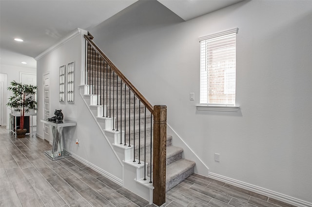 staircase with hardwood / wood-style flooring