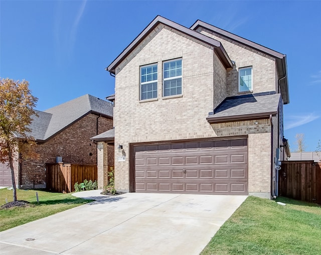 view of front facade featuring a garage and a front lawn