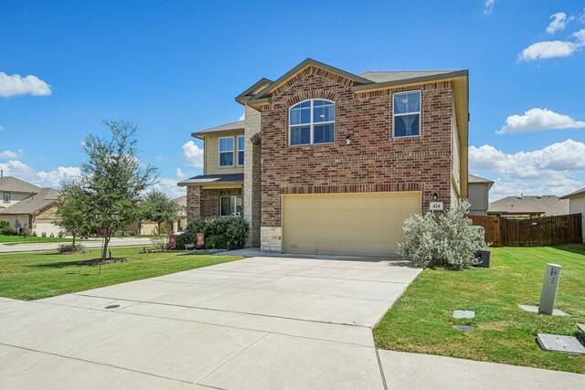 view of front property featuring a front yard and a garage