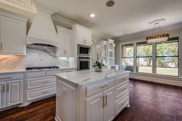 kitchen featuring pendant lighting, a center island, wine cooler, stainless steel fridge, and kitchen peninsula