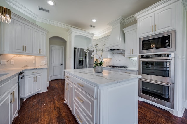 kitchen with white cabinetry, sink, a center island, vaulted ceiling with beams, and stainless steel dishwasher