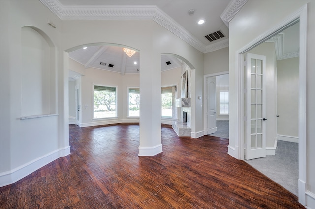 entrance foyer with french doors, dark hardwood / wood-style flooring, vaulted ceiling, and crown molding