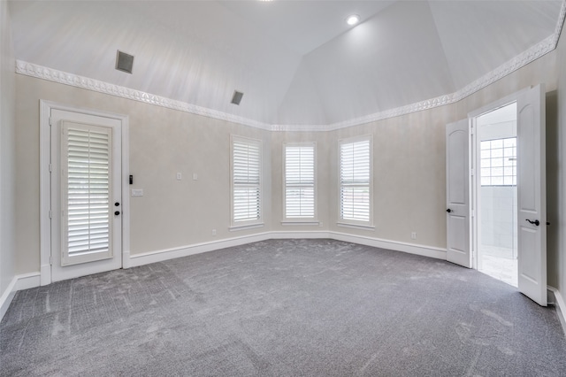 empty room featuring an inviting chandelier, light carpet, and vaulted ceiling