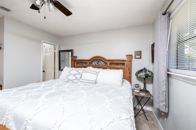 bedroom featuring ceiling fan and carpet floors