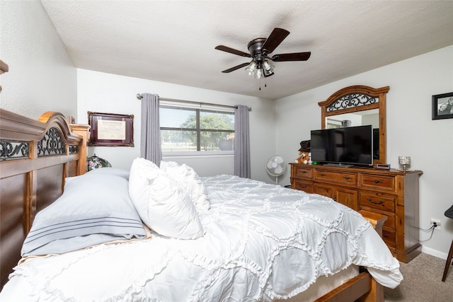 bedroom featuring carpet, a textured ceiling, and ceiling fan