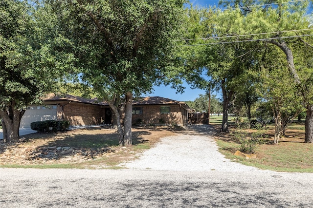 ranch-style home featuring a garage