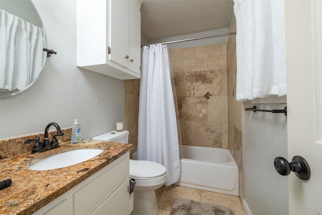 full bathroom featuring vanity, a textured ceiling, tile patterned flooring, toilet, and shower / bath combo with shower curtain