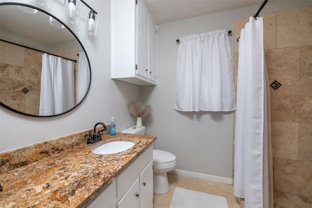 bathroom featuring toilet, vanity, a shower with shower curtain, and tile patterned flooring