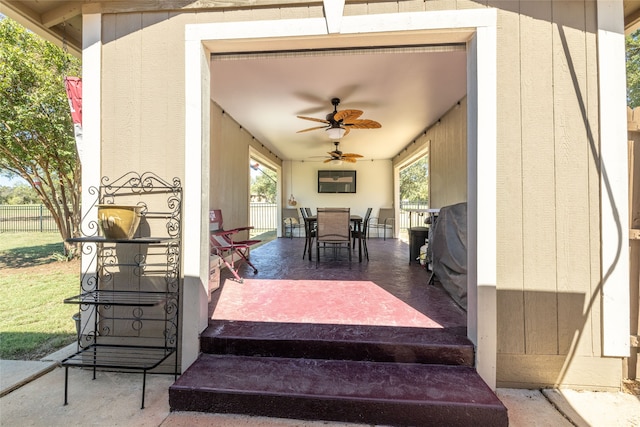 view of patio featuring ceiling fan