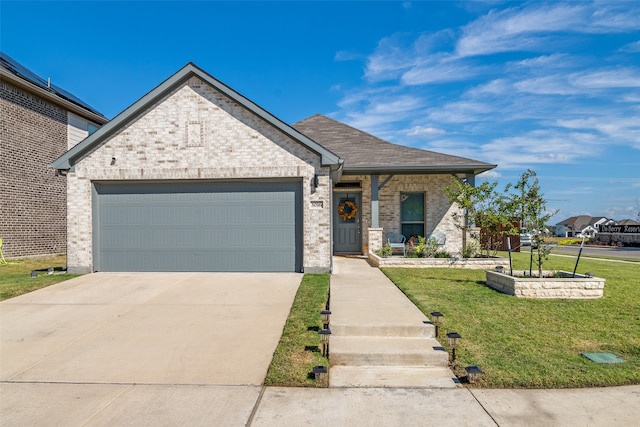 view of front facade featuring a front yard and a garage