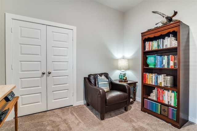 living area featuring carpet flooring