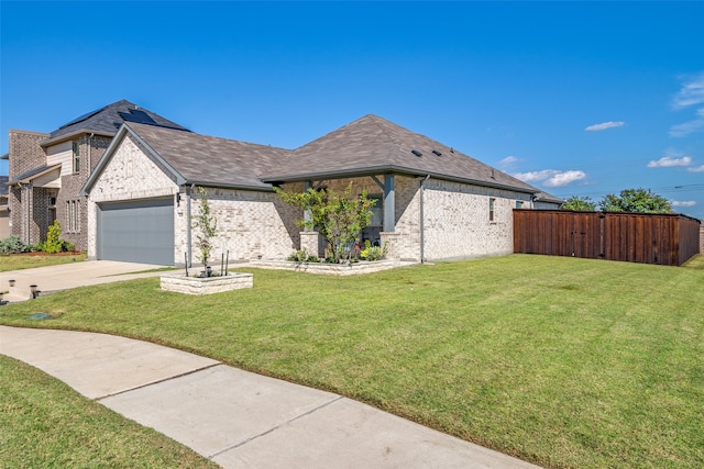 view of front facade featuring a garage and a front lawn